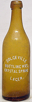 DOLGEVILLE BOTTLING WORKS CRYSTAL SPRING LAGER EMBOSSED BEER BOTTLE