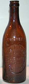 THE JOHN KUHLMANN BREWING COMPANY EMBOSSED BEER BOTTLE