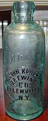 THE JOHN KUHLMANN BREWING COMPANY EMBOSSED BEER BOTTLE