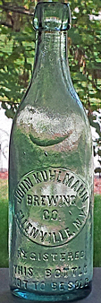 THE JOHN KUHLMANN BREWING COMPANY EMBOSSED BEER BOTTLE