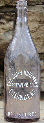 THE JOHN KUHLMANN BREWING COMPANY EMBOSSED BEER BOTTLE