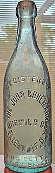 THE JOHN KUHLMANN BREWING COMPANY EMBOSSED BEER BOTTLE