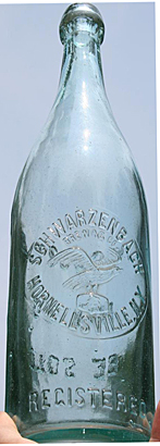 SCHWARZENBACH BREWING COMPANY EMBOSSED BEER BOTTLE