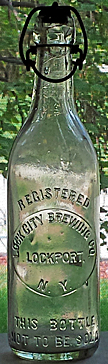LOCK CITY BREWING COMPANY EMBOSSED BEER BOTTLE