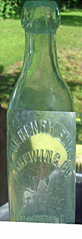 THE HENRY ELIAS BREWING COMPANY EMBOSSED BEER BOTTLE