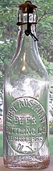 FIRST AUSTRIAN BEER BOTTLING COMPANY EMBOSSED BEER BOTTLE