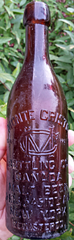 MONTE CRISTO BOTTLING COMPANY CANADA MALT BEER EMBOSSED BEER BOTTLE