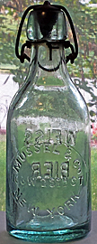 MUSSEL & COMPANY WEISS BIER EMBOSSED BEER BOTTLE