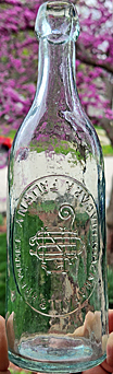 NIAGARA FALLS BREWING COMPANY EMBOSSED BEER BOTTLE