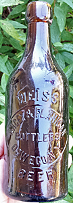 NACEY & FLANIGAN BOTTLERS WEISS BEER EMBOSSED BEER BOTTLE