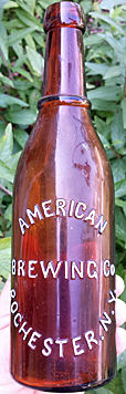 AMERICAN BREWING COMPANY EMBOSSED BEER BOTTLE