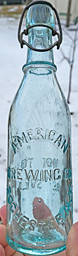 AMERICAN BREWING COMPANY EMBOSSED BEER BOTTLE