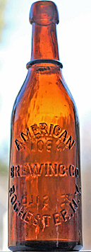 AMERICAN BREWING COMPANY EMBOSSED BEER BOTTLE