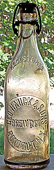 GEORGE HAUCK & SONS BREWING COMPANY EMBOSSED BEER BOTTLE