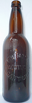 THE HOME BREWING COMPANY EMBOSSED BEER BOTTLE