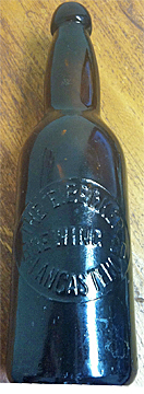 THE E. BECKER BREWING COMPANY EMBOSSED BEER BOTTLE