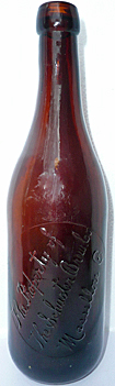 SCHUSTER BREWING COMPANY EMBOSSED BEER BOTTLE