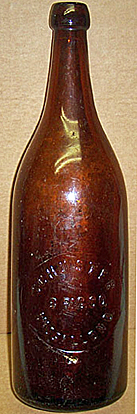 SCHUSTER BREWING COMPANY EMBOSSED BEER BOTTLE