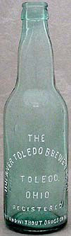 HUEBNER TOLEDO BREWERIES COMPANY EMBOSSED BEER BOTTLE