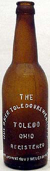 HUEBNER TOLEDO BREWERIES COMPANY EMBOSSED BEER BOTTLE