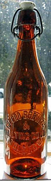 TOLEDO BREWING AND MALTING COMPANY LIMITED EMBOSSED BEER BOTTLE