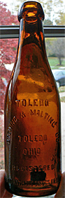 TOLEDO BREWING AND MALTING COMPANY EMBOSSED BEER BOTTLE