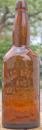 TOLEDO BREWING AND MALTING COMPANY BOTTLING WORKS EMBOSSED BEER BOTTLE