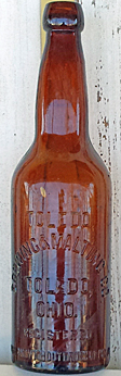 TOLEDO BREWING AND MALTING COMPANY EMBOSSED BEER BOTTLE