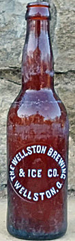 THE WELLSTON BREWING & ICE COMPANY EMBOSSED BEER BOTTLE