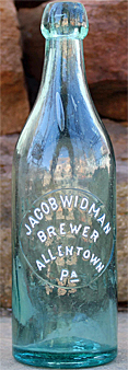 JACOB WIDMAN BREWER EMBOSSED BEER BOTTLE