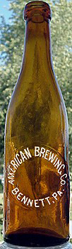 AMERICAN BREWING COMPANY EMBOSSED BEER BOTTLE