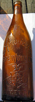 AMERICAN BREWING COMPANY EMBOSSED BEER BOTTLE