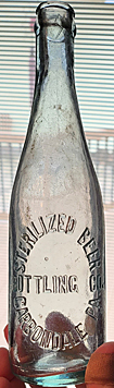 STERILIZED BEER BOTTLING COMPANY EMBOSSED BEER BOTTLE