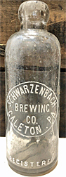 SCHWARZENBACH BREWING COMPANY EMBOSSED BEER BOTTLE