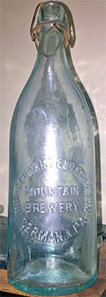 JOSEPH SCHWARZENBACH & SON MOUNTAIN BREWERY EMBOSSED BEER BOTTLE