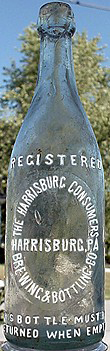 THE HARRISBURG CONSUMERS BREWING & BOTTLING COMPANY EMBOSSED BEER BOTTLE