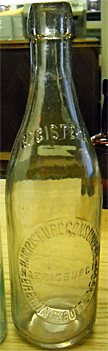 THE HARRISBURG CONSUMERS BREWING & BOTTLING COMPANY EMBOSSED BEER BOTTLE