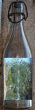 THE HARRISBURG CONSUMERS BREWING & BOTTLING COMPANY EMBOSSED BEER BOTTLE