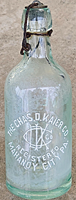 THE CHARLES D. KAIER COMPANY WEISS BEER EMBOSSED BEER BOTTLE