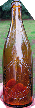 GAMBRINUS BREWING COMPANY EMBOSSED BEER BOTTLE