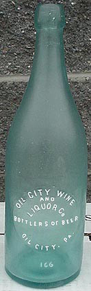 OIL CITY WINE AND LIQUOR COMPANY BOTTLERS OF BEER EMBOSSED BEER BOTTLE