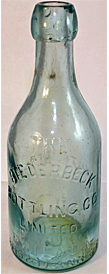 THE BIEDERBECK BOTTLING COMPANY LIMITED WHITE BEER EMBOSSED BEER BOTTLE