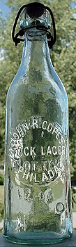 JOHN R. COPES STOCK LAGER EMBOSSED BEER BOTTLE