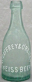 McCAFFREY & O'REILLY WEISS BEER EMBOSSED BEER BOTTLE