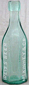 McKINNEY & CO WEISS BEER EMBOSSED BEER BOTTLE