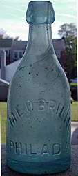 M. E. O'BRIEN WHITE BEER EMBOSSED BEER BOTTLE