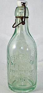 J. J. RATIGAN WEISS BEER EMBOSSED BEER BOTTLE