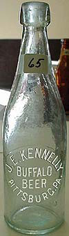 J. E. KENNELLY BUFFALO BEER EMBOSSED BEER BOTTLE