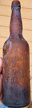 STAR BEER BOTTLING COMPANY EMBOSSED BEER BOTTLE