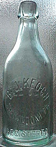 B. J. KEOGH WEISS BEER EMBOSSED BEER BOTTLE